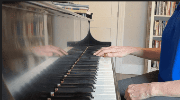 Demonstrating legato at the piano